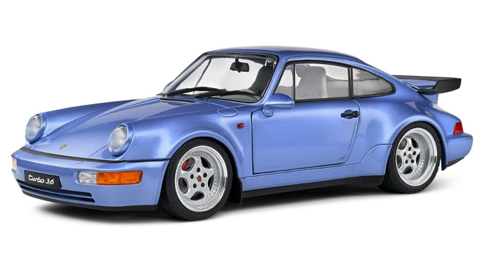 MODELLINO IN SCALA COMPATIBILE CON PORSCHE 911 964 TURBO COUPE 1990 MET.LIGHT BLUE 1:18 SOLIDO SL1803408