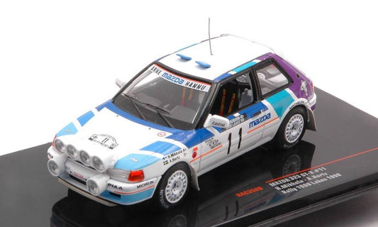 MODELE REDUIT COMPATIBLE AVEC MAZDA 323 GTX N.11 1000 LACS RALLY 1990 AVEC VEILLEUSES MIKK./HERTZ 1:43 IXO MODEL RAC358B
